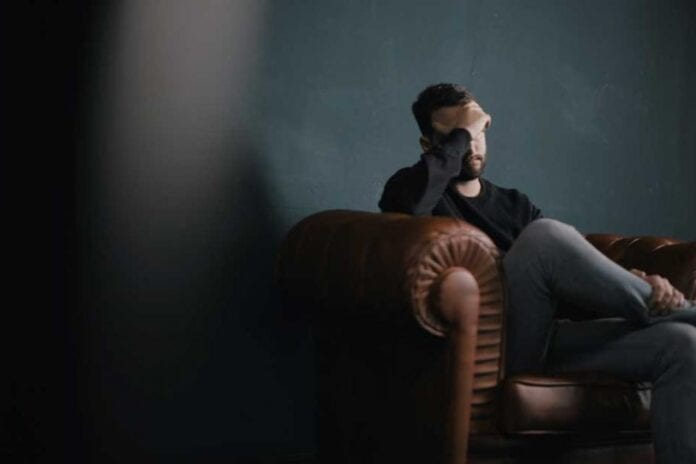 Sad-man-on-sofa