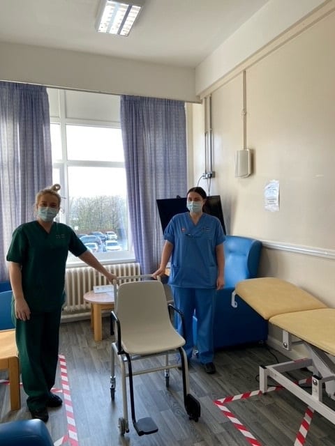 Health Care Support Worker Claire Davies and Staff Nurse Rhian James with the sit on weighing scales