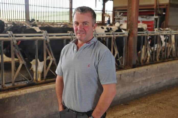 Russell Morgan with his dairy cows at Graig Olway farm