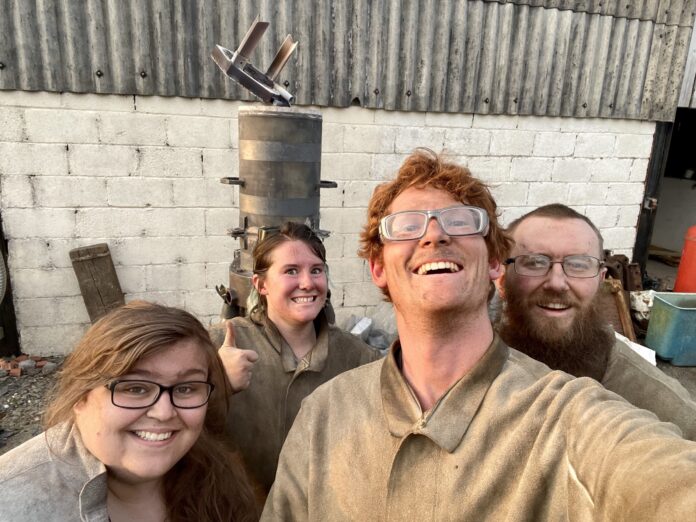 Happy-members-of-Moltan-Makers-in-front-of-their-furnace-scaled-1