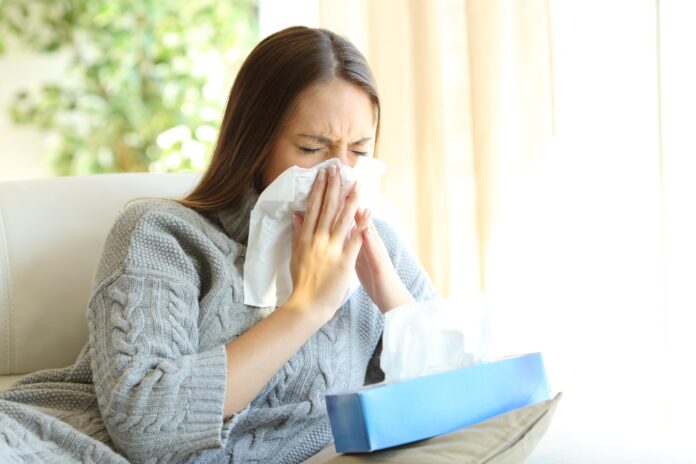 Woman-Sneezing-min-scaled-1