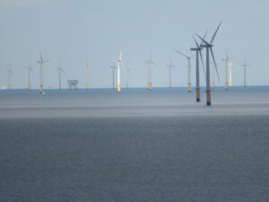 Gwynt_y_Mor_offshore_wind_farm_located_off_the_coast_of_Wales_from_Rhiwledyn_Little_Orm_Wales_20-300x225