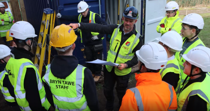 Pupils learning from contractors during the build