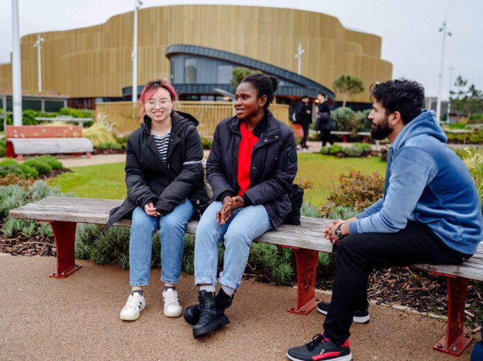 Swansea University students outside Swansea Arena